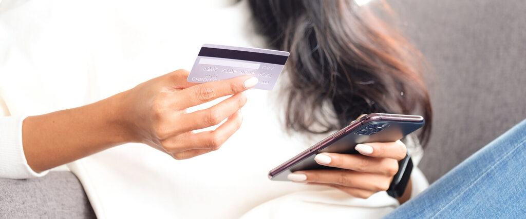 An individual paying for therapy on their phone. Representing how WHCC offers self-pay for child counseling in Katy, TX. Explore the benefits of self-pay here.