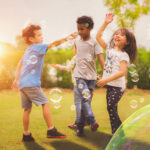 A group of children blowing bubbles & running around. If you suspect your child has anxiety, consider reaching out for a child therapist in Katy, TX. We are here to help your child thrive.