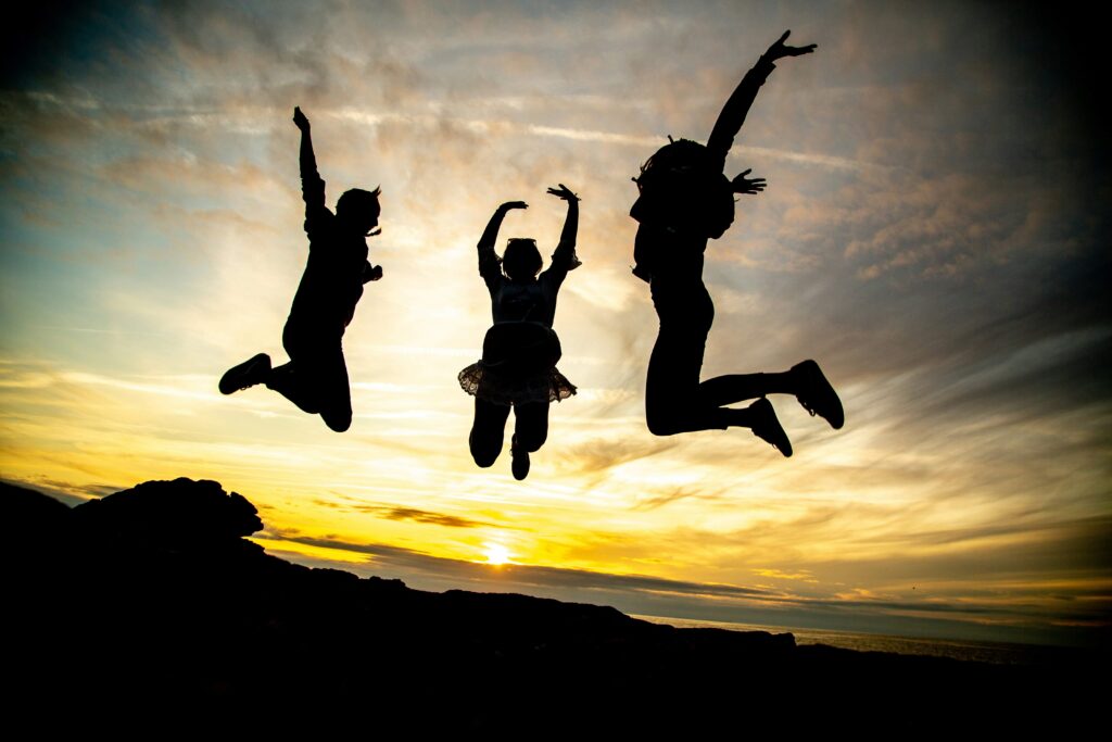 A silhouette of 3 teenagers jumping in the air. Our teen therapy in Katy, TX can help with child anxiety & more. Reach out today to learn more.