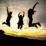 A silhouette of 3 teenagers jumping in the air. Our teen therapy in Katy, TX can help with child anxiety & more. Reach out today to learn more.